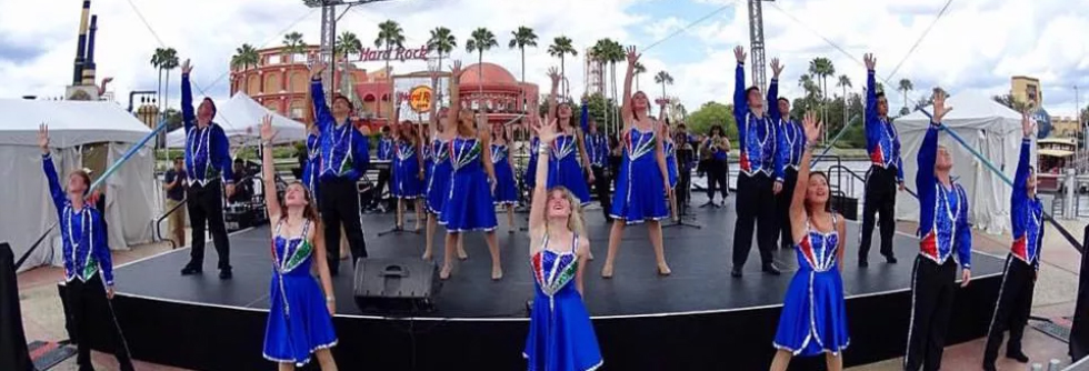 Students doing a performance on stage outside